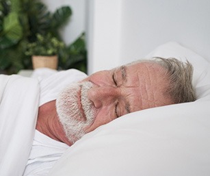 Man sleeping in a bed