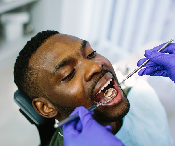 a patient having their mouth examined