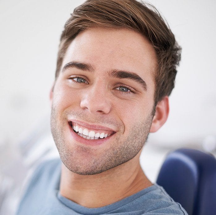 Smiling man in dental chair