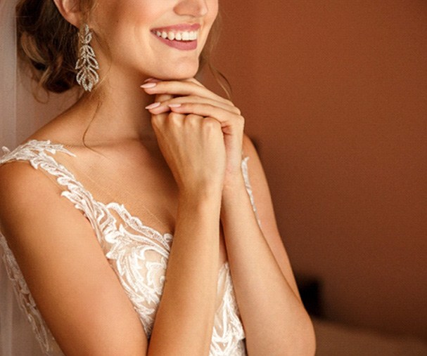 Bridge smiling in a wedding dress