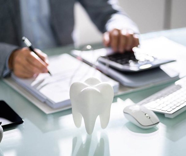 A patient calculating the cost of dental crowns