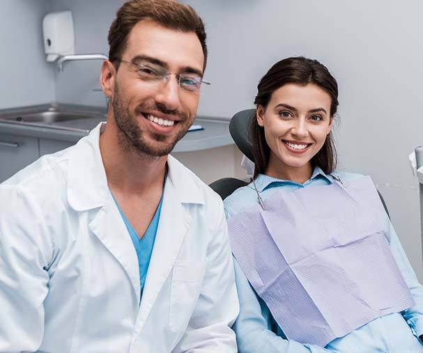 Patient smiling with dentist in emergency dental office in Sparta