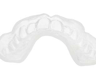 A clear, custom-made mouthguard from a dentist
