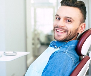 Smiling dental patient visiting emergency dentist in Sparta, NJ