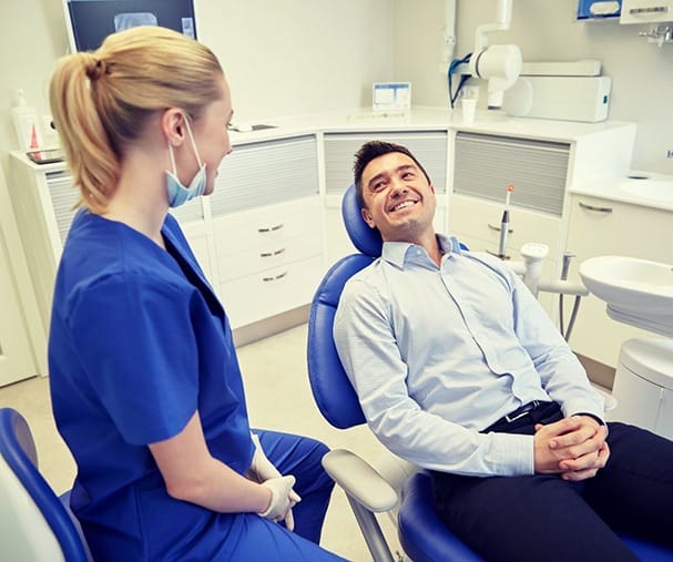 man smiling in dental chair