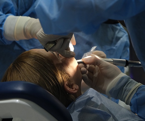 Woman getting dental surgery