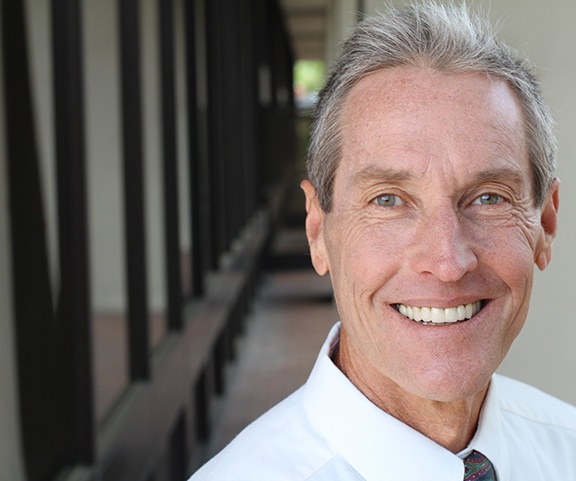 Man smiling in an office