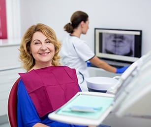 older woman at her dental implant consultation 