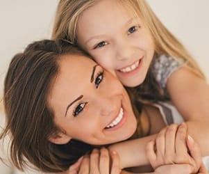 Smiling mother and daughter