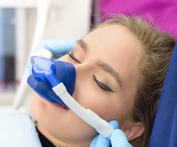 Woman with nitrous oxide nose mask