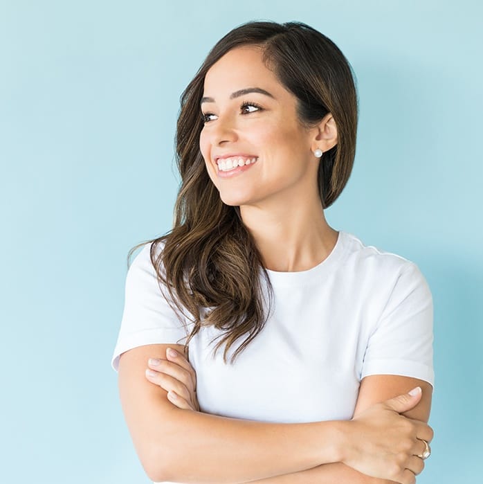 Woman smiling with her arms folded