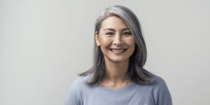 woman smiling with dental implants
