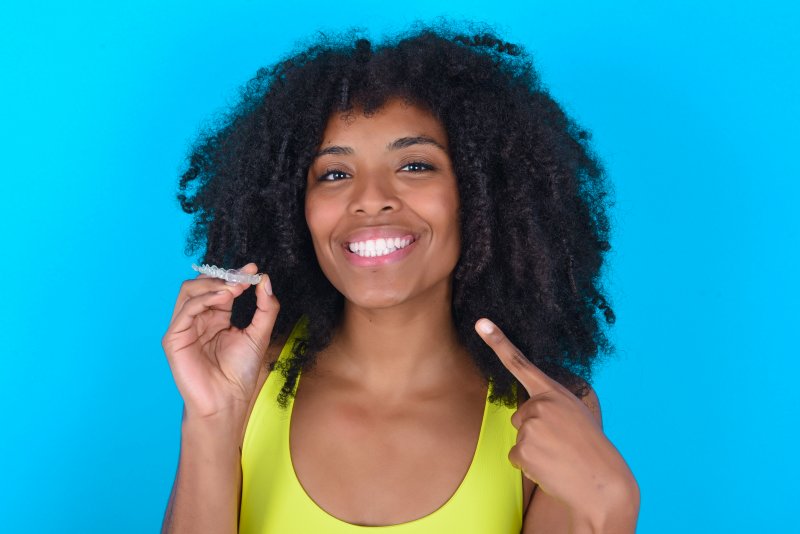 woman smiling after removing clear aligners in Sparta