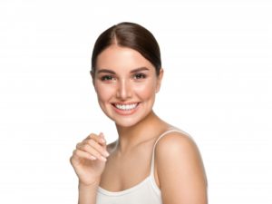 a woman smiling with veneers